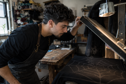 Lifting the heat press on a fresh web print